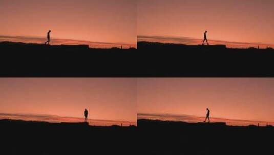 夕阳下行走的男子剪影高清在线视频素材下载