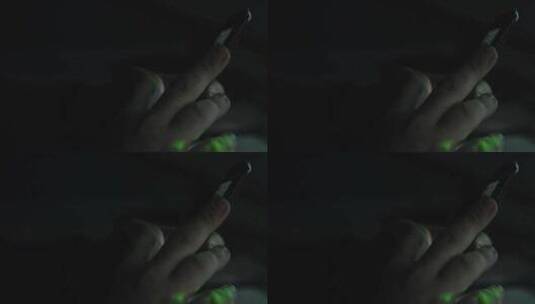 绿光从男人的手和手机上反射出来高清在线视频素材下载