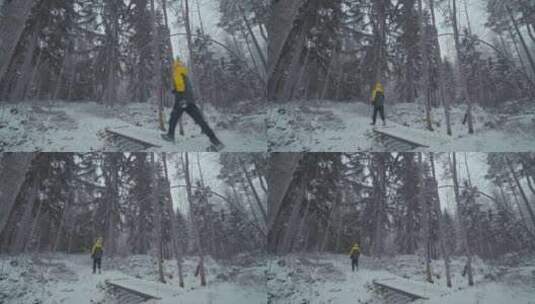 男人在冬天的森林雪地行走高清在线视频素材下载