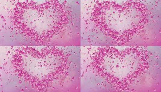 飞舞的梦幻粉色花瓣组成爱心高清在线视频素材下载