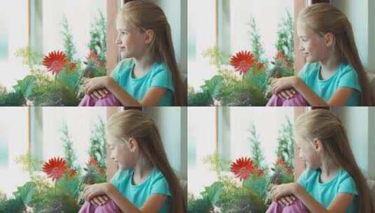 坐在窗台上对镜头笑的女孩高清在线视频素材下载