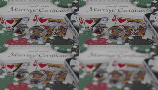 结婚戒指和结婚证放在扑克牌和筹码上高清在线视频素材下载