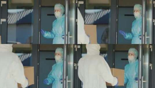 两名医护人员在门口交接药箱高清在线视频素材下载