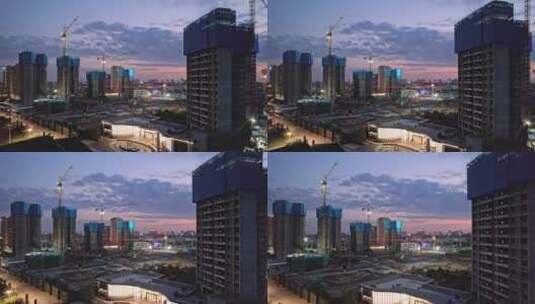 现代城市高层建筑施工工地傍晚航拍高清在线视频素材下载