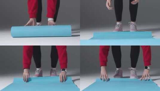 女孩滚瑜伽垫的中间镜头高清在线视频素材下载
