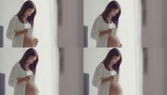 孕妇正在抚摸肚子高清在线视频素材下载
