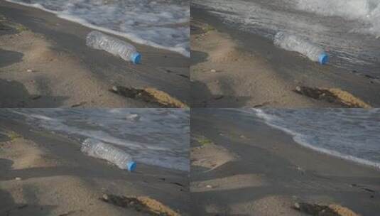 躺在沙滩上的塑料瓶高清在线视频素材下载