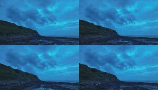 夜晚海边沙滩礁石航拍阴天大海天空晚上风景高清在线视频素材下载