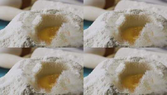 鸡蛋落入面粉中慢动作高清在线视频素材下载