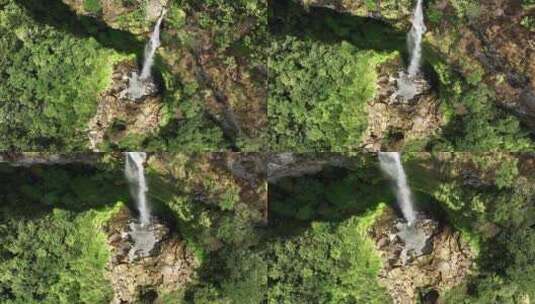 阳光照在桂林喀斯特地貌山谷中的瀑布高清在线视频素材下载
