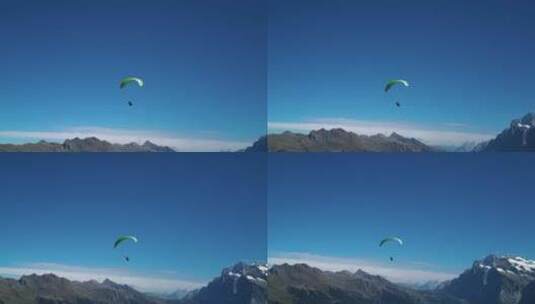 滑翔伞降落在山顶平地高清在线视频素材下载