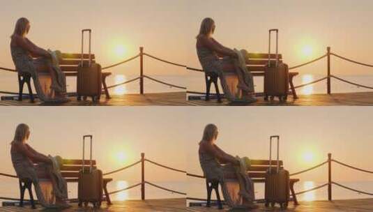 女游客在码头欣赏日落高清在线视频素材下载