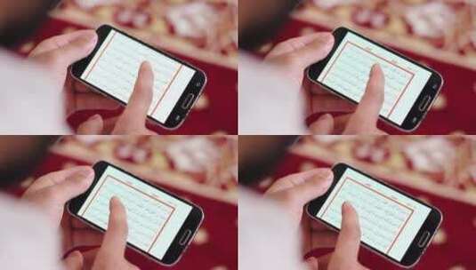 穆斯林男子在手机上阅读古兰经高清在线视频素材下载