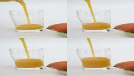 把新鲜芒果汁倒入杯中高清在线视频素材下载