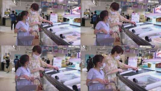 疫情期间戴口罩在商场超市采购商品的母女高清在线视频素材下载