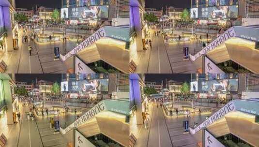 杭州湖滨龙翔桥步行街下沉广场夜景行人穿梭高清在线视频素材下载