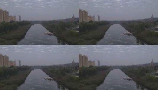 乌云密布下的城市河流来回穿梭的车辆高清在线视频素材下载