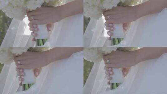 新娘的手拿着戒指和花束高清在线视频素材下载
