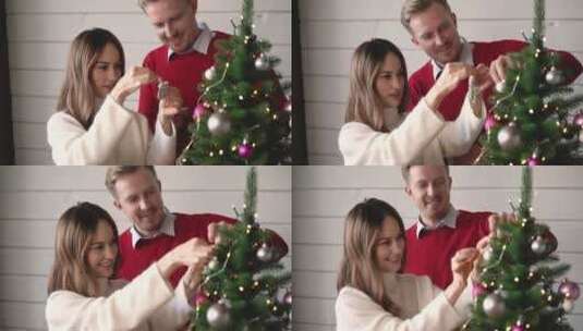 夫妻一起装饰圣诞树高清在线视频素材下载