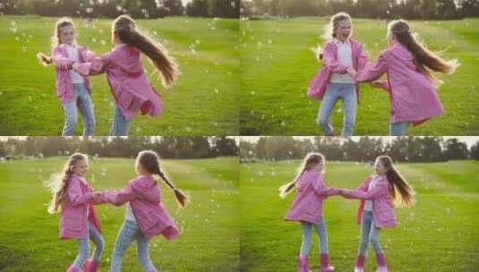 草坪上玩耍快乐的小姐妹高清在线视频素材下载