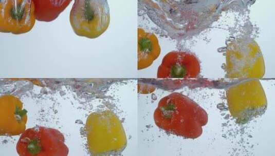 红辣椒和黄辣椒倒入水中的慢镜头高清在线视频素材下载