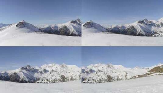 冬季雄伟的阿尔卑斯山白雪覆盖的山峰和山脊上的全景高清在线视频素材下载