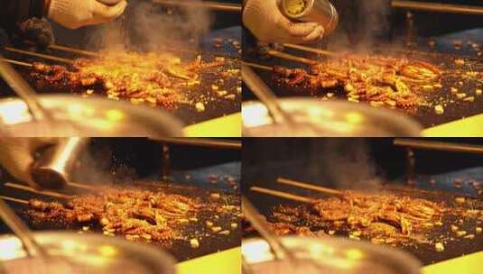 中国哈尔滨师大夜市铁板烤鱿鱼高清在线视频素材下载