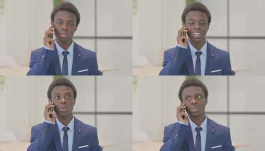 年轻非洲商人打电话的肖像高清在线视频素材下载