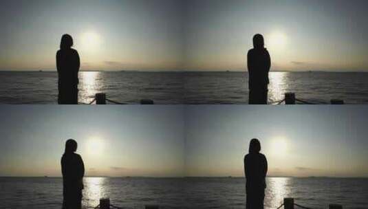 女人站在海边看日落看风景看日出看夕阳看海高清在线视频素材下载