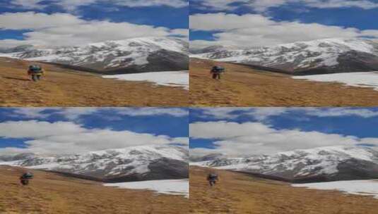 攀登横断山脉勒多曼因雪山的登山者徒步进山高清在线视频素材下载