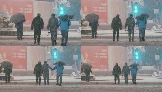 大雪中绿灯通行的行人1高清在线视频素材下载