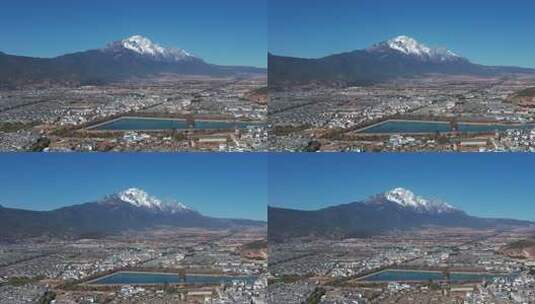 航拍云南旅游玉龙雪山丽江古城建筑群街景高清在线视频素材下载