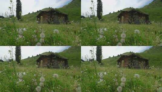 山间草地中的木屋自然景象高清在线视频素材下载