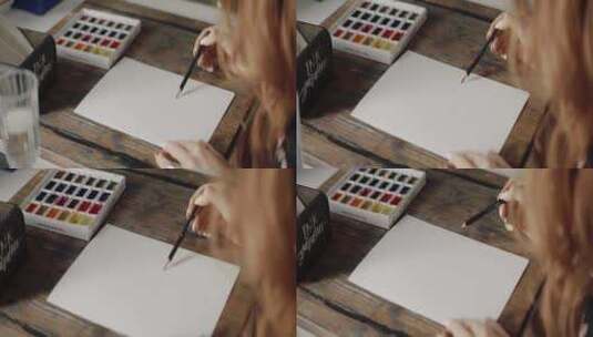 一个在纸上画画的人高清在线视频素材下载