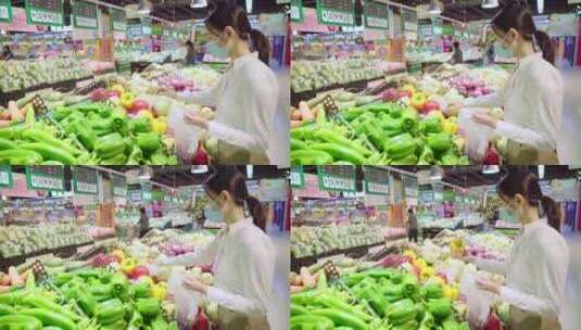 戴口罩的青年女人在超市选购蔬菜高清在线视频素材下载