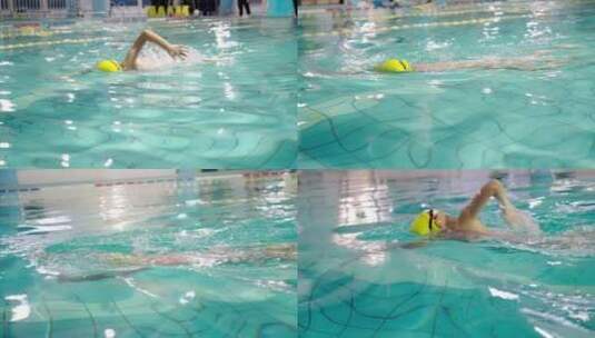 游泳池中练习游泳的中国女孩高清在线视频素材下载