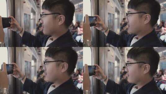 男人在火车上用手机拍照高清在线视频素材下载