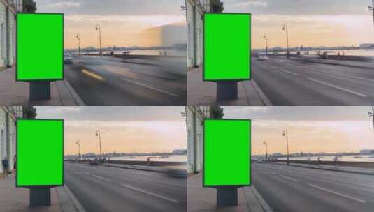 繁忙道路上的绿屏广告牌高清在线视频素材下载