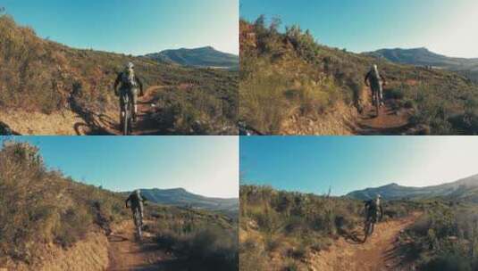 第一视角拍摄骑山地自行车的骑手高清在线视频素材下载