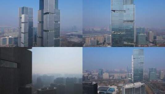 郑州绿地中心双子塔商业大楼航拍旋转由远近高清在线视频素材下载