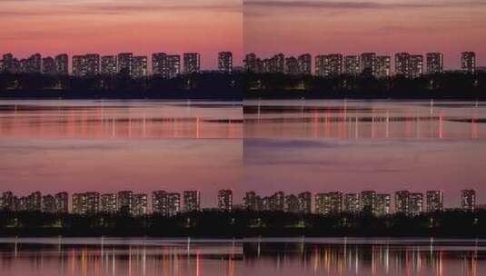 晚霞城市河水岸边建筑楼房夜晚灯光高清在线视频素材下载