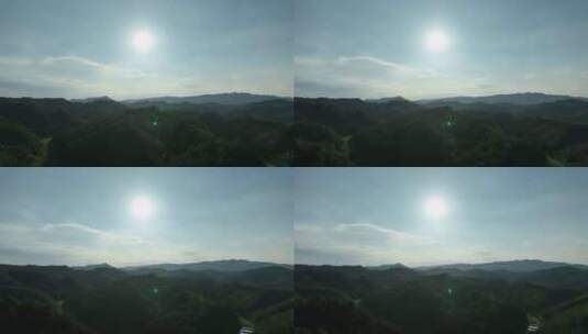 山峰阳光森林航拍山脉夕阳逆光天空太阳树林高清在线视频素材下载