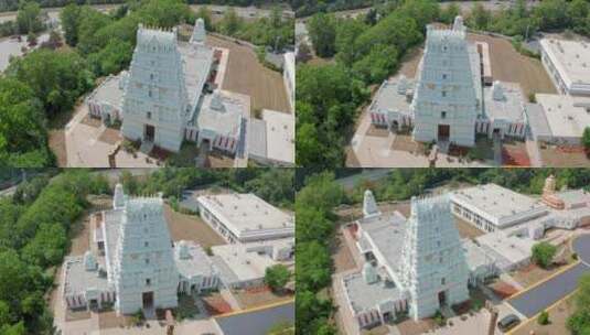 白天，无人机在路边旋转拍摄白色印度教南印度寺庙。高清在线视频素材下载