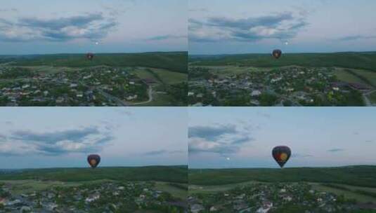 小村庄上空的热气球高清在线视频素材下载
