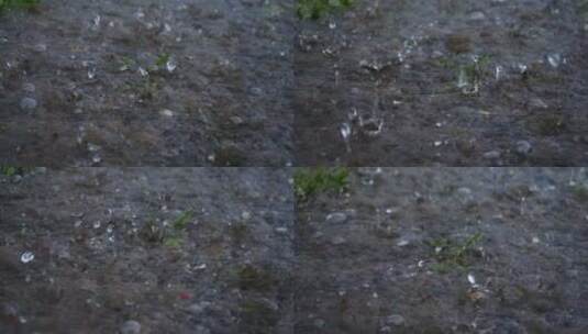 暴雨下雨雨滴落在地面上溅起水花高清在线视频素材下载
