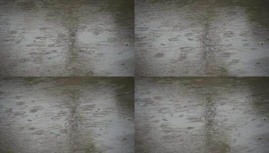 水泥地面雨水溅起水花高清在线视频素材下载