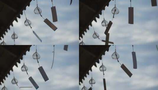 天空屋檐下随风飘动的风铃高清在线视频素材下载