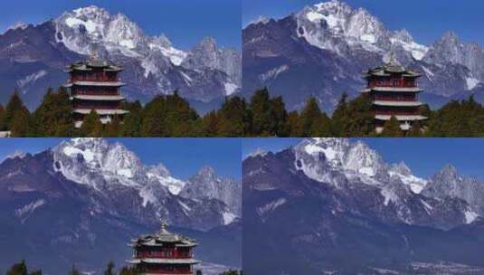 航拍云南丽江古城狮子山古城楼和雪山高清在线视频素材下载