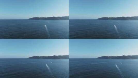 航拍三亚亚龙湾游艇在蓝色大海上航行高清在线视频素材下载