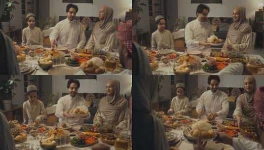 欢快的穆斯林家庭成员在开斋节餐桌上分享食高清在线视频素材下载